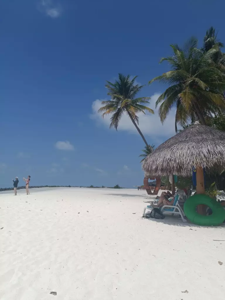 Sandbank surrounded by shallow turquoise water in the Maldives